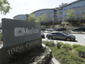 A YouTube sign is shown across the street from the company's offices in San Bruno, Calif., Tuesday, April 3, 2018. A woman opened fire at YouTube headquarters Tuesday, setting off a panic among employees and wounding several people before fatally shooting herself, police and witnesses said.