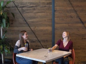 Tiffany Leeson, left, and Jillian Lucas are pictured in a Toronto bar on Friday, April 20, 2018. Seeing trash cans overflowing with straws night after night has prompted a server in Toronto to launch a campaign against the plastic item that's become a target of the British government as it aims to rid such pollution from oceans, though Canada has stopped short of pushing for a similar commitment. Jillian Lucas said her 10-year career in the restaurant business provided her with contacts at establishments that will be joining forces for The Last Straw on Saturday, when servers won't be providing straws in drinks, unless customers ask for them.