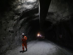 A miner works at a copper mine in the Andes mountains in Chile.