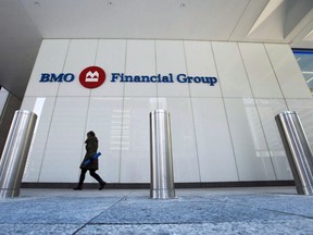 A women walks into the The BMO office tower in Toronto's financial district in Toronto on Tuesday, April 5, 2016.