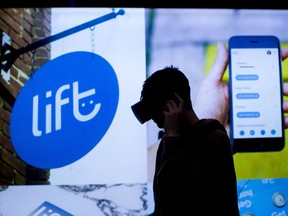 A man wears a virtual reality headset at the Lift Cannabis Expo in Vancouver, B.C., on Sunday, January 14, 2018. Lift.co, which hosts industry events and provides education, has seen its Facebook ad account deactivated and their YouTube channel shut down.