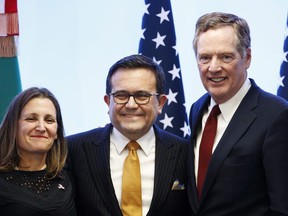 Canadian Foreign Affairs Minister Chrystia Freeland, left, Mexico's Secretary of Economy Ildefonso Guajardo Villarreal, center, and U.S. Trade Representative Robert Lighthizer pose for a photo at a press conference regarding the seventh round of NAFTA renegotiations in Mexico City, Monday, March 5, 2018. The three NAFTA countries are in Washington today trying to come to terms on the broad outlines of an interim agreement.