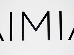 An AIMIA logo is shown at the company's annual general meeting in Montreal, Friday, May 4, 2012. The research company that wrote a controversial survey for Aeroplan is considering changing its questions.