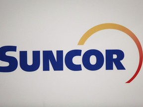 Suncor Energy Inc. logo at the company's annual meeting in Calgary, April 27, 2017. Three Colorado communities have filed a lawsuit demanding that Calgary-based Suncor Energy Inc. and U.S. giant ExxonMobil Corp. "pay their fair share" of costs associated with climate change.