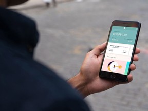 A Wealthsimple program is shown on a cell phone in this handout Wealthsimple has partnered with EQ Bank to launch the Smart Savings accounts in Canada, which offer an interest rate of 1.7 per cent on deposits up to $100,000.