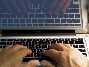 Hands type on a computer keyboard in Los Angeles on Feb. 27, 2013. The death of the password could be upon us. A new security standard recently endorsed by the World Wide Web Consortium has experts excited about the prospect of making logins "unphishable" and ending the vulnerabilities that currently exist because so many users have poor "password hygiene" and reuse the same one across countless websites.