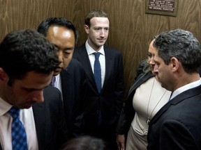 Facebook CEO Mark Zuckerberg, center, leaves a meeting with Sen. John Thune, R-S.D. on Capitol Hill in Washington, Monday, April 9, 2018. Zuckerberg will testify Tuesday before a joint hearing of the Commerce and Judiciary Committees about the use of Facebook data to target American voters in the 2016 election.