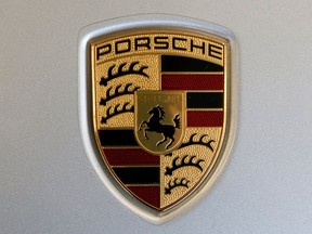 FILE - The Feb. 15, 2018 file photo shows a Porsche logo on a 2018 718 Cayman automobile on display at the Pittsburgh Auto Show. German police searched offices of Porsche on Wednesday, April 18, 2018.