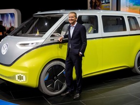 FILE - In a Jan. 9, 2017, file photo, Herbert Diess, chairman of the Volkswagen brand, poses with the I.D. Buzz all-electric concept van, at the North American International Auto Show, in Detroit. Volkswagen's supervisory board on Thursday, April 12, 2018 appointed Diess as CEO of the Volkswagen concern.