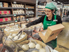 A T&T Supermarket employee prepares freshly cooked stuffed buns at a store in Markam, Ont.