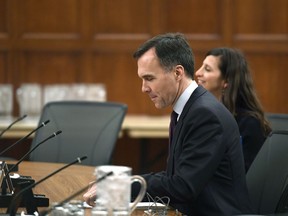 Minister of Finance Bill Morneau prepares to testify at a Commons status of women committee with department officials on the effect of Budget 2018 on women and girls in Canada, on Parliament Hill in Ottawa on Monday, April 30, 2018.