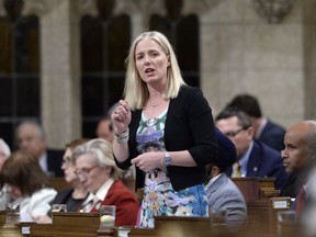 Minister of Environment and Climate Change Catherine McKenna rises during Question Period in the House of Commons on Parliament Hill in Ottawa on Tuesday, April 24, 2018.