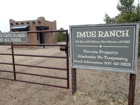 FILE - This April 12, 2017, file photo, shows the entrance to the Imus Ranch, owned by radio personality Don Imus, in Ribera, N.M. The sprawling cattle ranch in northern New Mexico is for sale, The Santa Fe New Mexico reports. The 2,400-acre ranch near the small community of Ribera, and about 45 miles east of Santa Fe, has been used to benefit children afflicted by cancer.