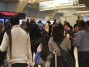 This photo provided by Alyssa Stinson shows passengers being evacuated at the Ontario Airport, Monday, April 23, 2018 in Ontario, Calif. All gates at Southern California's Ontario International Airport are open again after part of a terminal was briefly evacuated while a bomb squad investigated a suspicious device. Fire Department Battalion Chief Jim Schiller says the item found in a passenger's luggage Monday was determined to be an inert device typically used for military training.