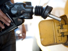 FILE - In this Aug. 10, 2012 file photo a customer pumps gas into his dual-tank pickup truck at a 76 gas station in Los Angeles. Environmental Protection Agency Administrator Scott Pruitt indicated this week he may target a longstanding federal waiver that allows California to set its own, tougher tailpipe emission standards, an exception that's allowed the state to prod the rest of nation to do more against air pollution and climate change for a half-century.