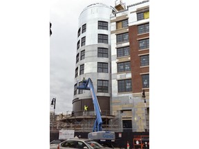 This April 18, 2018 photo shows construction progress on the hotel portion of the MGM Casino in downtown Springfield, Mass., which is on track to open in August, a few weeks ahead of schedule. MGM Resorts International President Bill Hornbuckle said in a Wednesday interview with The Associated Press that August 24 is the new planned opening date for its $960 million downtown resort complex. The company had previously envisioned opening it sometime in September.