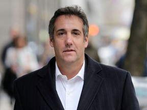 In this Wednesday, April 11, 2018, photo, Michael Cohen, President Donald Trump's personal attorney, walks along a sidewalk in New York. The company that publishes the National Enquirer paid a former doorman at one of Trump's New York skyscrapers $30,000 during the presidential campaign for a tip about Trump it never ran. Dino Sajudin signed a contract with American Media Inc. that barred him from discussing his tip with anyone. Cohen acknowledged to the AP that he had discussed Sajudin's story with the magazine when the tabloid was working on it. He said he was acting as a Trump spokesman when he did so and denied knowing anything beforehand about the Enquirer payment to the ex-doorman.