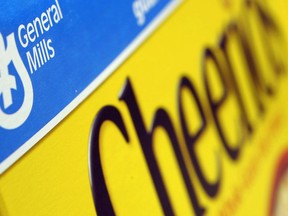FILE - This Dec. 15, 2007, file photo, shows a box of General Mills' Cheerios on a shelf at a Shaw's Supermarket in Gloucester, Mass. General Mills, the maker of Cheerios and Yoplait yogurt, recently lowered its projection for full-year profit growth as it grapples with increasing expenses for everything from fruits to nuts to freight.