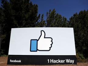 FILE- This March 28, 2018, file photo shows the Facebook logo at the company's headquarters in Menlo Park, Calif. Facebook is asking users whether they think it's "good for the world" in a poll sent to an unspecified number of people.