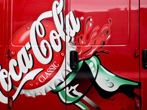FILE- This Feb. 23, 2017, file photo shows a delivery van is painted with artwork for Classic Coca-Cola in downtown Pittsburgh. Coca-Cola Co. reports earnings Tuesday, April 24, 2018.