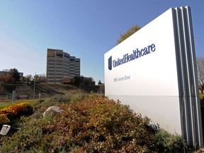 FILE - This Oct. 16, 2012, file photo, shows a portion of the UnitedHealth Group Inc.'s campus in Minnetonka, Minn. Some major health insurers plan to take a little sting out of prescription drug prices by giving customers rebates at the pharmacy counter, and they could spark a trend. Aetna and UnitedHealthcare both say they will begin passing rebates they get from drugmakers along to some of their customers starting next year.
