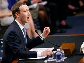 FILE- In this Tuesday, April 10, 2018, file photo, Facebook CEO Mark Zuckerberg testifies before a joint hearing of the Commerce and Judiciary Committees on Capitol Hill in Washington. Zuckerberg repeatedly assured lawmakers Tuesday and Wednesday that he didn't believe the company violated its 2011 agreement with the Federal Trade Commission to overhaul its privacy practices.