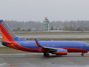 In this April 13, 2018, photo, a Southwest Airlines plane taxis at the Seattle-Tacoma International Airport in Seattle. Southwest Airlines Co. reports earns on Thursday, April 26, 2018.