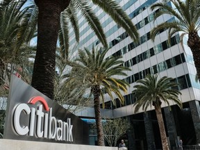 FILE- This March 23, 2018, file photo shows the entrance to Citibank at the Citigroup Center in downtown Los Angeles. Citigroup reports earnings Friday, April 13, 2018.