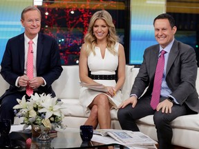 FILE - In this Jan. 17, 2018 file photo, "Fox & Friends" co-hosts, from left, Steve Doocy, Ainsley Earhardt and Brian Kilmeade appear on their set in New York. Roughly 1.5 million people watch "Fox & Friends" each day, more than its counterparts at CNN and MSNBC and less than half the audiences for "Good Morning America" or "Today."