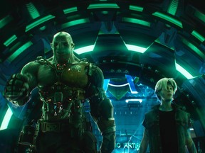 This cover image released by Warner Bros. Pictures shows characters Aech, left, and Parzival in a scene from "Ready Player One," a film by Steven Spielberg.