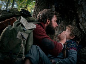 This image released by Paramount Pictures shows John Krasinski, left, and Noah Jupe in a scene from "A Quiet Place."