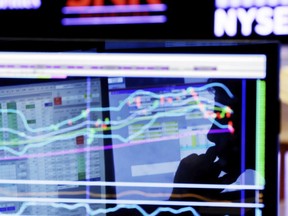 FILE - In this Jan. 11, 2016, file photo, specialist Anthony Rinaldi is silhouetted on a screen at his post on the floor of the New York Stock Exchange. The U.S. stock market opens at 9:30 a.m. EDT on Monday, April 24, 2018.