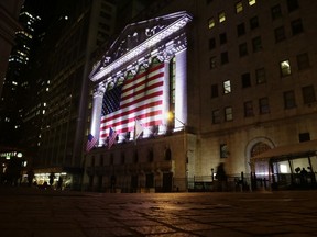 FILE- In this Feb. 17, 2017, file photo, an American flag hangs on the front of the New York Stock Exchange in New York. The U.S. stock market opens at 9:30 a.m. EDT on Friday, April 6, 2018.