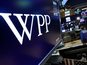 The logo for WPP appears above a trading post on the floor of the New York Stock Exchange, Wednesday, April 4, 2018. Shares in WPP, the world's largest advertising agency, have fallen after an announcement that the board is investigating an allegation of personal misconduct against its chief executive, Martin Sorrell.