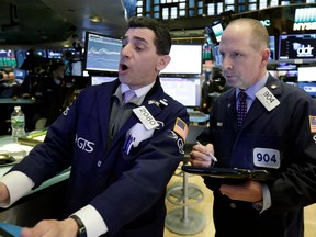 Specialist Peter Mazza, left, and trader Michael Urkonis work on the floor of the New York Stock Exchange, Thursday, April 5, 2018. Stocks are opening higher on Wall Street as the market builds on a solid gain from late in the day before.