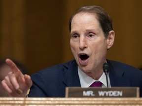 FILE - In this Nov. 28, 2017, file photo, Sen. Ron Wyden speaks during a committee hearing on Capitol Hill in Washington. TFor the first time, the U.S. government is publicly acknowledging the existence in Washington of what appear to be rogue devices that foreign spies and criminals could be using to track individual cellphones and intercept calls and messages. In a March 26 letter to Wyden obtained by the Associated Press, the Department of Homeland Security acknowledged that it identified suspected unauthorized cell-site simulators in Washington last year.
