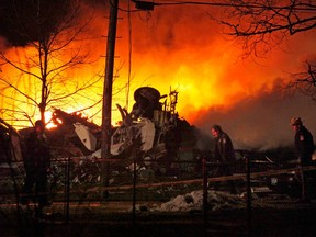 FILE – This Feb. 12, 2009, file photo shows a plane burning after it crashed into a house, killing 49 people on board and one on the ground, in Clarence Center, N.Y. The death of a passenger on a Southwest Airlines flight that made an emergency landing in Philadelphia on Tuesday, April 17, 2018, was the first fatality from an in-flight accident on a U.S. airliner since Feb. 12, 2009, when the flight from Newark Liberty International Airport in Newark, N.J., plunged to the ground on approach to Buffalo Niagara International Airport in Buffalo, N.Y.