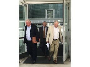 Backpage.com founders James Larkin, left, and Michael Lacey, right, leave U.S. District Court in downtown Phoenix on Monday, April 30, 2018. A judge set a January 2020 trial date for Larkin and Lacey on charges that they knowingly ran prostitution ads and laundered money earned from the classified advertising site. The founders and five site employees have pleaded not guilty to charges.