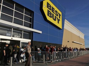 This photo taken Nov. 23, 2017, shows holiday shoppers pouring into Best Buy to get an early start to the Black Friday sale at Chimney Rock Shopping Center,  in Odessa, Texas.  Best Buy is warning that some of its customers' payment information may have been compromised in a data breach. The retailer is the latest company, along with Delta Air Lines and Sears, to report the cyberattack last fall against a third-party operator of its chat services. Best Buy says a "small fraction" of its online customer population may have been affected, whether or not chat services were used.