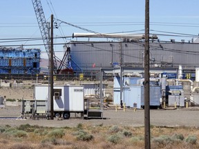 This May 13, 2017, photo shows a portion of the Plutonium Finishing Plant on the Hanford Nuclear Reservation near Richland, Wash. Officials say dozens of workers demolishing the 1940s-era plutonium processing plant there have ingested or inhaled radioactive particles in the past year, prompting a halt to the demolition of the plant until a safe plan can be developed.