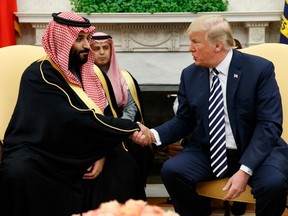 FILE - In this March 20, 2018, file photo, President Donald Trump shakes hands with Saudi Crown Prince Mohammed bin Salman in the Oval Office of the White House in Washington. The Trump administration is signing off on selling more than $1.3 billion in artillery to Saudi Arabia. The State Department says the administration told Congress on April 5 that it plans to approve the sale. The package includes about 180 Paladin howitzer systems. The artillery-firing vehicles launch 155mm shells.