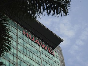 In this March 13, 2018, photo, the logo of Huawei is displayed at its headquarters in Shenzhen in southern China's Guangdong Province. As trade disputes simmer between the U.S. and China, Chinese telecommunications giant Huawei is being squeezed out of American markets and is shifting its expansion efforts toward Europe and Asia.