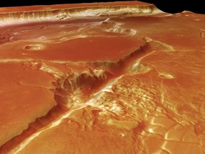 FILE - This 2006 file photo released by the European Space Agency, ESA, shows a photo shot by European space ship 'Mars Express' of a gigantic glacial valley on planet Mars. The European Space Agency plans to remotely update the software on its Mars Express probe to ensure the aging spacecraft remains stable. The probe arrived at Mars in late 2003 for a two-year mission, but almost 15 years later it's still operating. ESA said Wednesday April 11, 2018 that four of Mars Express' six gyroscopes _ used to measure the probe's rotation _ are failing, ending the mission's in 2019.