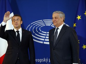 French President Emmanuel Macron, left, is welcomed by European Parliament president Antonio Tajani upon his arrival at the European Parliament in Strasbourg, eastern France, Tuesday, April 17, 2018. In his speech to European lawmakers Tuesday in Strasbourg, France, Macron will launch a drive to seek European citizens' opinions on the European Union's future.