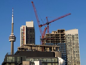 Construction cranes are seen in Toronto.