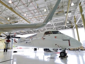 A Bombardier turboprop passenger plane sits in a hangar at the Bombardier facility in Toronto.