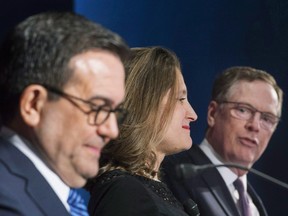Foreign Affairs Minister Chrystia Freeland and Mexico's Secretary of Economy Ildefonso Guajardo Villarrea look on as United States Trade Representative Robert Lighthizer delivers his statements to the media during the sixth round of NAFTA talks on January 29, 2018.