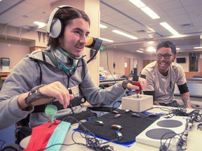 A disabled gamer plays a game using the Xbox Adaptive Controller.