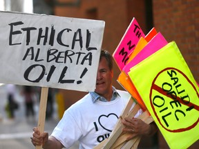 A Trans Mountain pipeline supporter outside the Kinder Morgan annual meeting in downtown Calgary on Wednesday.