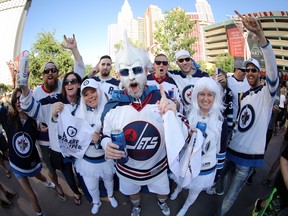 Winnipeg Jets fans cheer on their team outside T-Mobile Arena before the Jets face the Vegas Golden Knights during Western Conference Finals, game 3, in Las Vegas, Wednesday, May 16, 2018.